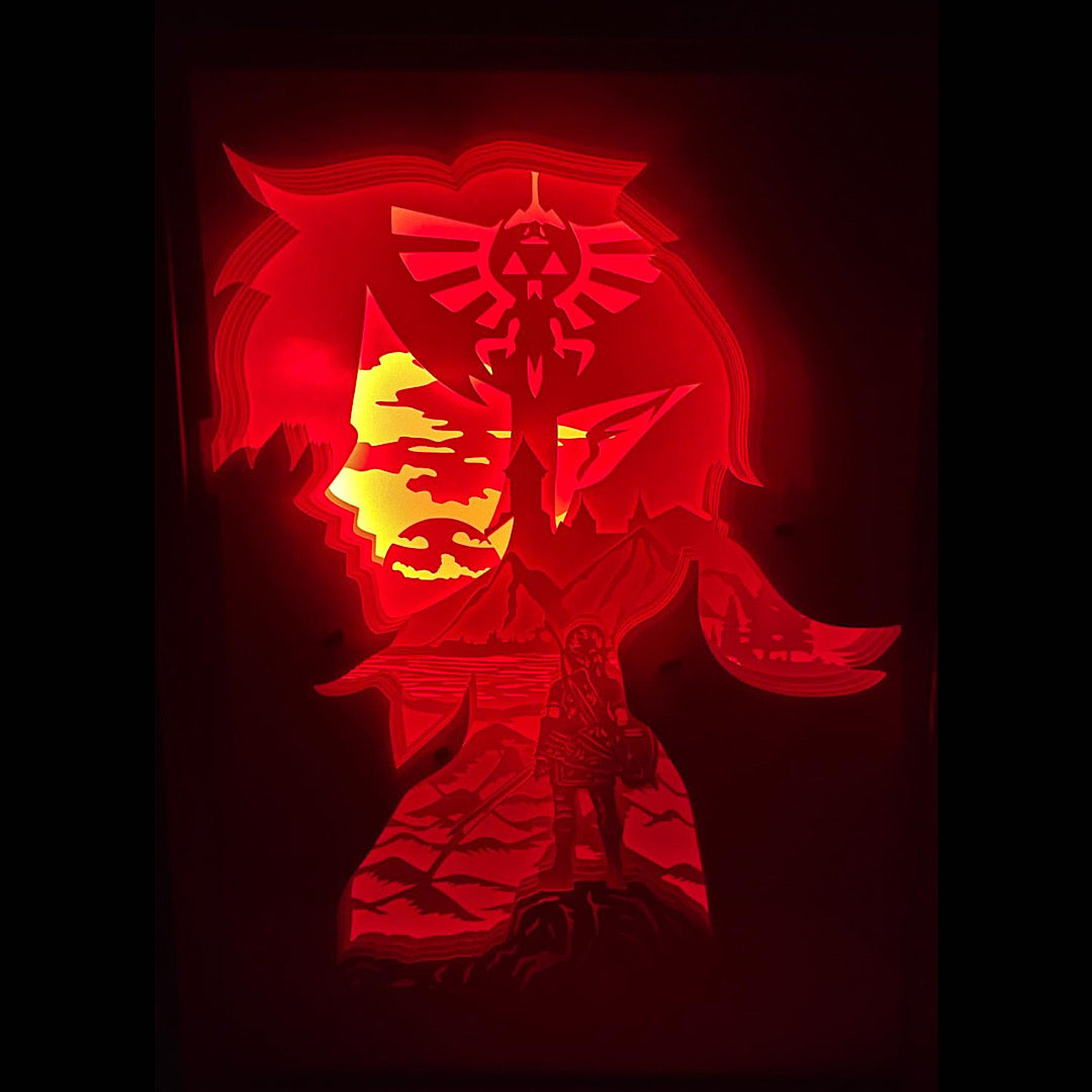 Zelda, The Legend of Zelda, Link, Princesse Zelda, Ganondorf, Triforce, Hyrule, épée de légende, Master Sword, Ocarina of Time, Breath of the Wild, Tears of the Kingdom, tableau lumineux Zelda, lightbox Zelda, shadowbox Zelda, cadre lumineux jeu vidéo, décoration geek, art lumineux fantasy, idée cadeau gamer, décoration murale Zelda, univers Nintendo, héros légendaire, aventure épique