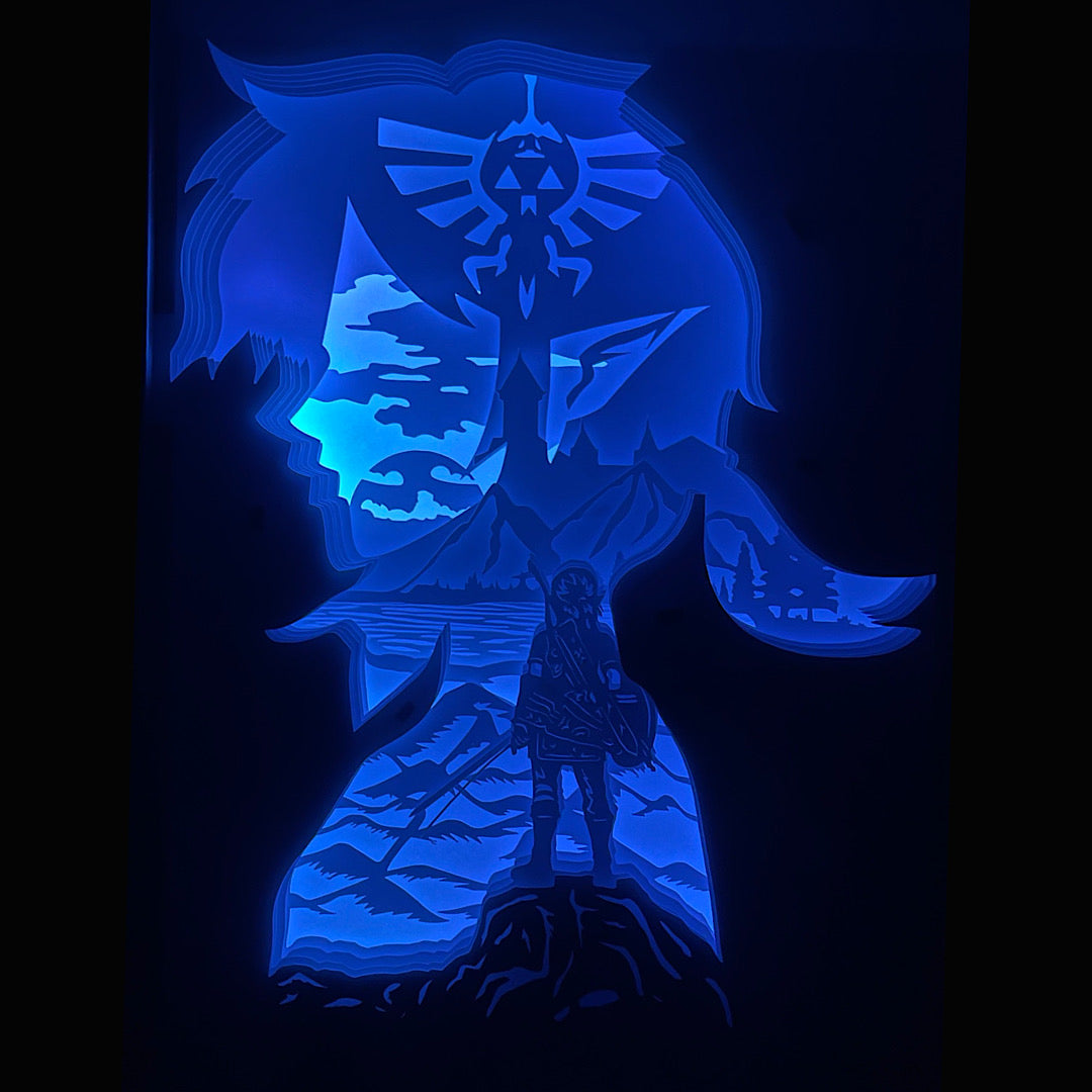 Zelda, The Legend of Zelda, Link, Princesse Zelda, Ganondorf, Triforce, Hyrule, épée de légende, Master Sword, Ocarina of Time, Breath of the Wild, Tears of the Kingdom, tableau lumineux Zelda, lightbox Zelda, shadowbox Zelda, cadre lumineux jeu vidéo, décoration geek, art lumineux fantasy, idée cadeau gamer, décoration murale Zelda, univers Nintendo, héros légendaire, aventure épique