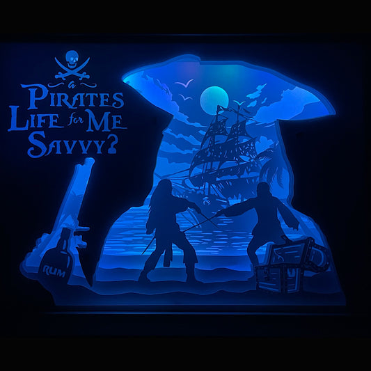 Pirates des Caraïbes, Pirates of the Caribbean, Disney, Jack Sparrow, capitaine Jack, Will Turner, Elizabeth Swann, capitaine Barbossa, Davy Jones, Black Pearl, Hollandais volant, mer des Caraïbes, navire pirate, coffre maudit, univers marin, film culte, saga Disney, aventure maritime, fantômes pirates, magie vaudou, abordage, tableau lumineux, lightbox, shadowbox, cadre lumineux, papier découpé, art lumineux, décoration murale, idée cadeau Disney, déco geek, cadeau fan Pirates
