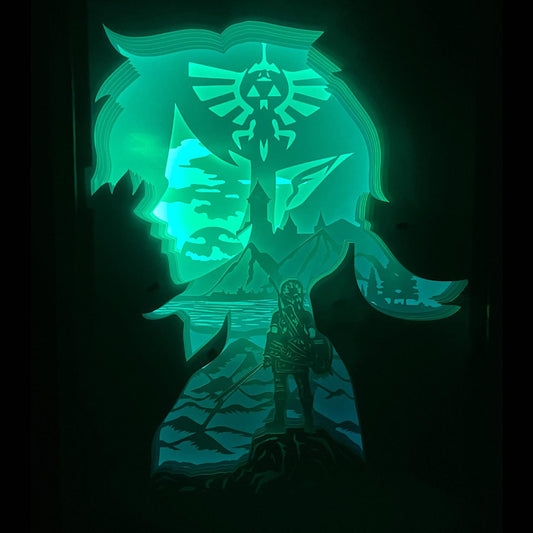 Zelda, The Legend of Zelda, Link, Princesse Zelda, Ganondorf, Triforce, Hyrule, épée de légende, Master Sword, Ocarina of Time, Breath of the Wild, Tears of the Kingdom, tableau lumineux Zelda, lightbox Zelda, shadowbox Zelda, cadre lumineux jeu vidéo, décoration geek, art lumineux fantasy, idée cadeau gamer, décoration murale Zelda, univers Nintendo, héros légendaire, aventure épique